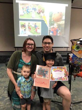 The Morgan family attending a preschool graduation.