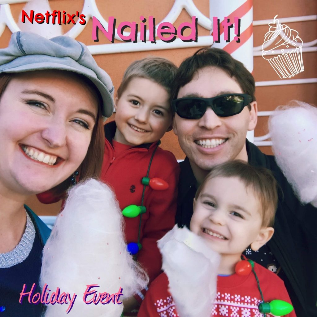 The Morgan family posing in front of a gingerbread house, eating cotton candy