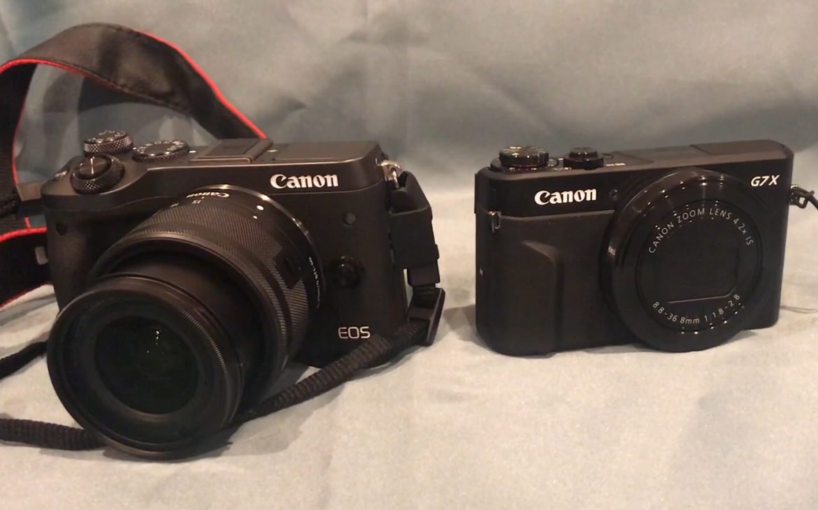 two cameras next to eachother, the canon eos m6 mirrorless camera vs. the canon g7x mark ii