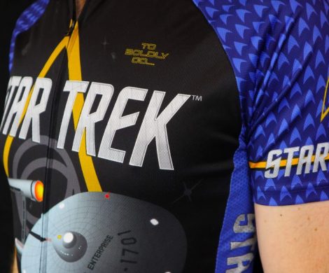 Closeup of a blue Star Trek cycling jersey featuring the Enterprise and delta logo, part of the fitness apparel line from Brainstorm Gear