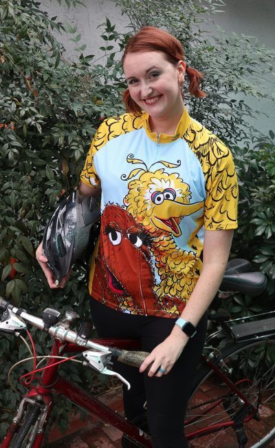 Redhead girl wearing a Big Bird and Snuffleupagus Cycling Jersey