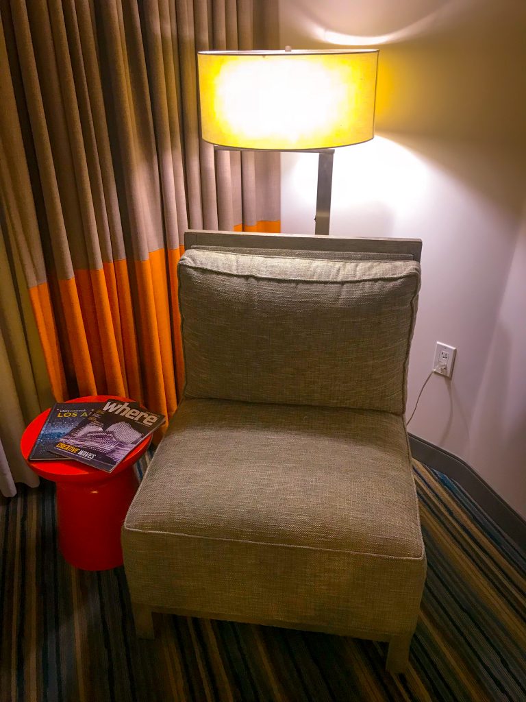 tan colored chair and curtain in the hotel room at The Shore Hotel Santa Monica