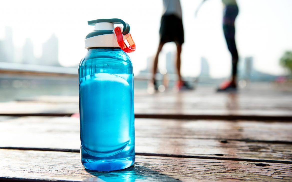 blue reusable water bottle with a cap and clip