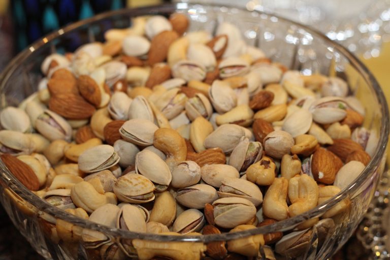 A bowl of cashews and pistachios, for the article on how to save money on food at theme parks