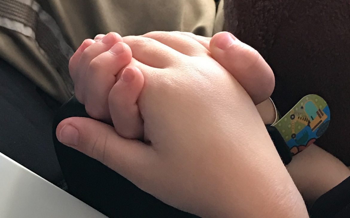 Two children holding hands