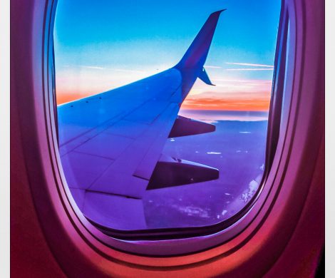 The sunset looking out an airplane window