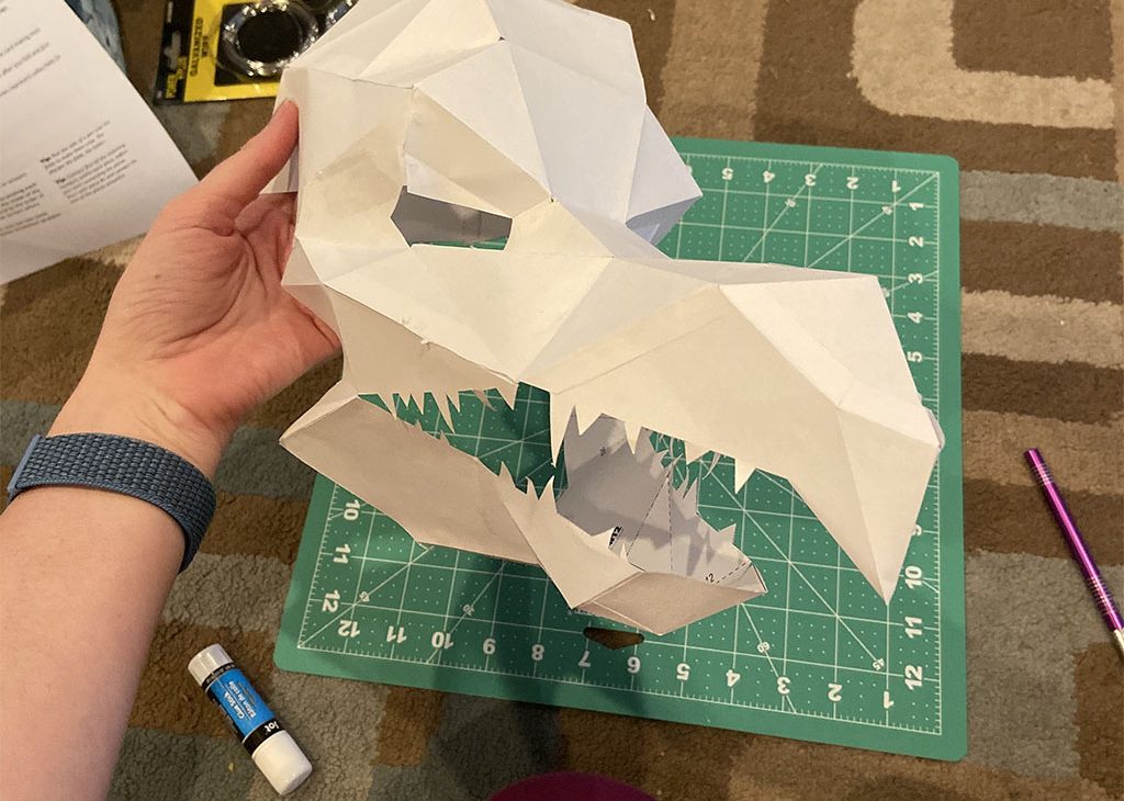 A Skeksis mask made out of paper