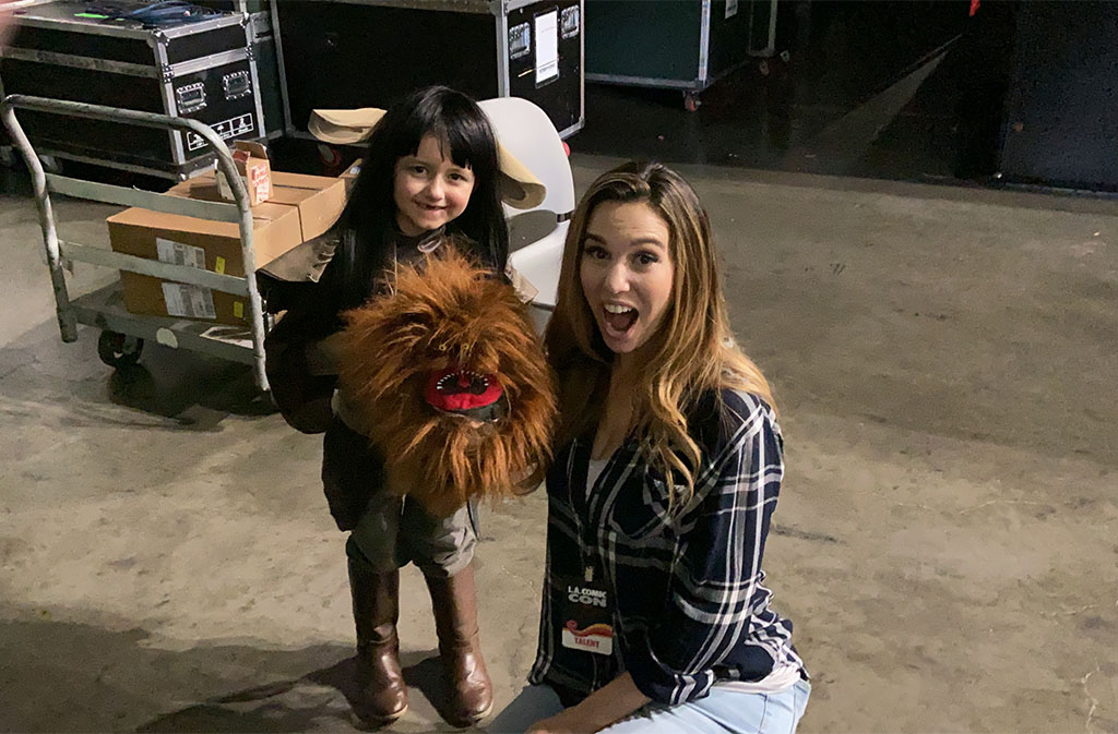 Actress Christy Carlson Romano with a Fizzgig puppet backstage at LA Comic Con